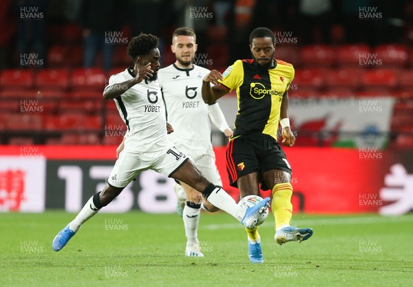 240919 - Watford v Swansea City, Carabao Cup, Third Round - Nathaniel Chalobah of Watford is challenged  by Nathan Dyer of Swansea City