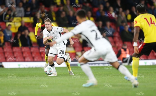 240919 - Watford v Swansea City, Carabao Cup, Third Round - George Byers of Swansea City plays the ball past Nathaniel Chalobah of Watford to Yan Dhanda of Swansea City