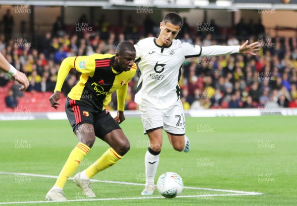 240919 - Watford v Swansea City, Carabao Cup, Third Round - Yan Dhanda of Swansea City takes on Abdoulaye Doucoure of Watford