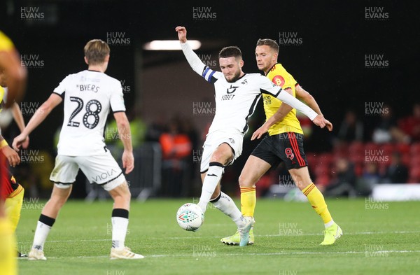 240919 - Watford v Swansea City, Carabao Cup, Third Round - Matt Grimes of Swansea City and Tom Cleverley of Watford compete for the ball