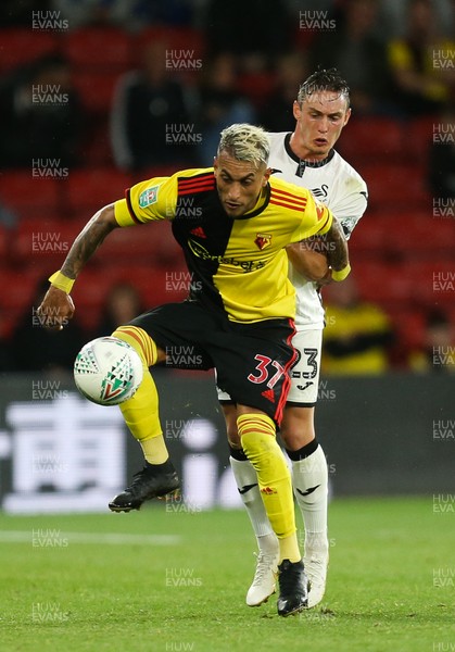 240919 - Watford v Swansea City, Carabao Cup, Third Round - Roberto Pereyra of Watford is challenged by Connor Roberts of Swansea City