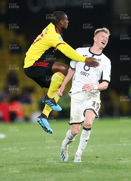240919 - Watford v Swansea City, Carabao Cup, Third Round - Sam Surridge of Swansea City and Christian Kabasele of Watford compete for the ball