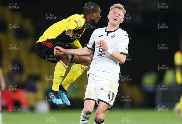 240919 - Watford v Swansea City, Carabao Cup, Third Round - Sam Surridge of Swansea City and Christian Kabasele of Watford compete for the ball