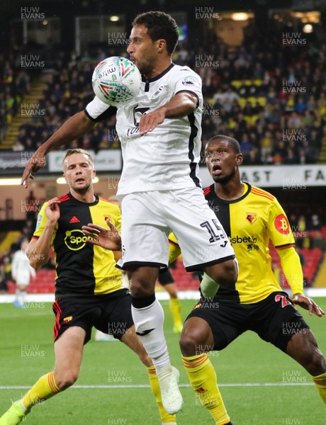 240919 - Watford v Swansea City, Carabao Cup, Third Round - Wayne Routledge of Swansea City wins the ball from Christian Kabasele of Watford