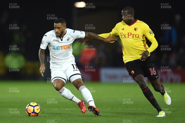 301217 - Watford v Swansea City - Premier League - Luciano Narsingh of Swansea City is tackled by Abdoulaye Doucoure of Watford