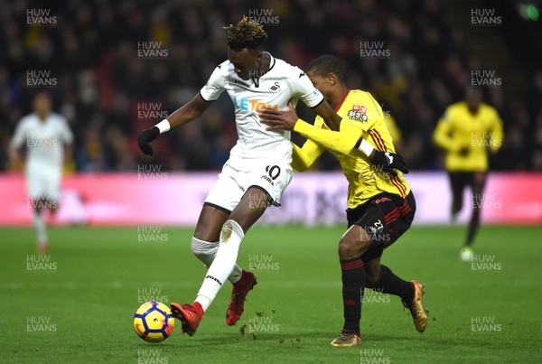 301217 - Watford v Swansea City - Premier League - Tammy Abraham of Swansea City is tackled by Christian Kabasele of Watford