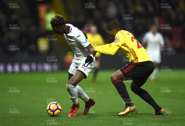 301217 - Watford v Swansea City - Premier League - Tammy Abraham of Swansea City is tackled by Christian Kabasele of Watford
