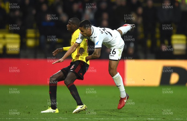 301217 - Watford v Swansea City - Premier League - Kyle Naughton of Swansea City is tackled by Abdoulaye Doucoure of Watford