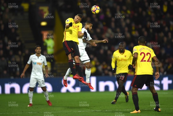 301217 - Watford v Swansea City - Premier League - Richarlison of Watford and Luciano Narsingh of Swansea City compete for the ball in the air