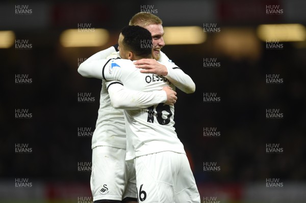 301217 - Watford v Swansea City - Premier League - Oliver McBurnie and Martin Olsson (left) of Swansea City celebrates at the final whistle