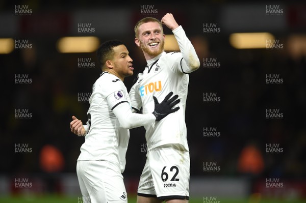301217 - Watford v Swansea City - Premier League - Oliver McBurnie and Martin Olsson (left) of Swansea City celebrates at the final whistle