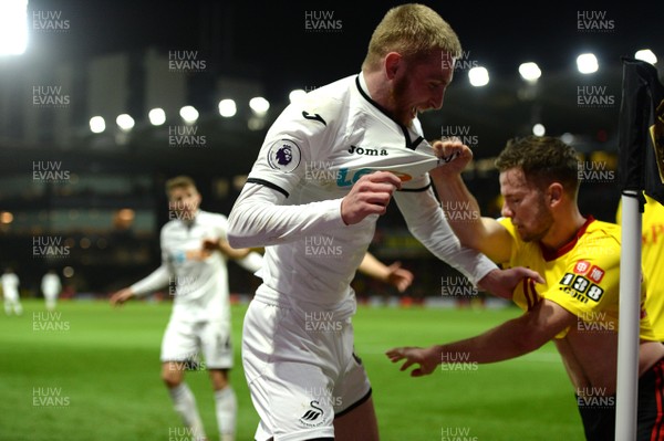 301217 - Watford v Swansea City - Premier League - Oliver McBurnie of Swansea City tangles with Tom Cleverley of Watford