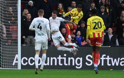 310126 - Watford v Swansea City, EFL Sky Bet Championship - Thomas Ince of Watford looks to head at goal as Josh Tymon of Swansea City challenges
