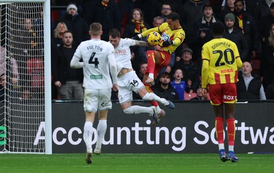 310126 - Watford v Swansea City, EFL Sky Bet Championship - Thomas Ince of Watford looks to head at goal as Josh Tymon of Swansea City challenges