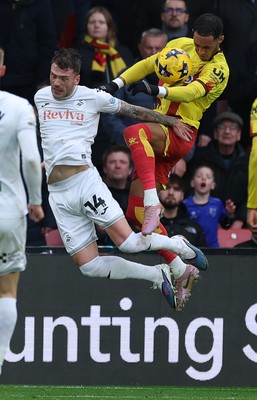 310126 - Watford v Swansea City, EFL Sky Bet Championship - Thomas Ince of Watford looks to head at goal as Josh Tymon of Swansea City challenges