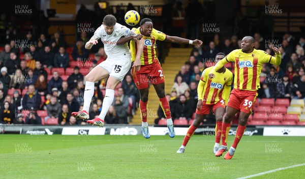 310126 - Watford v Swansea City, EFL Sky Bet Championship - Cameron Burgess of Swansea City and Jeremy Ngakia of Watford compete for the ball