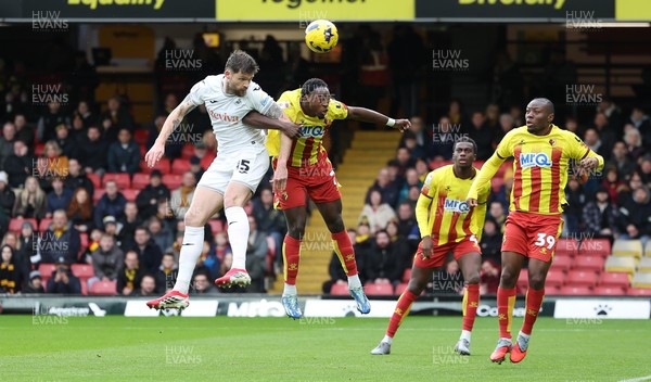 310126 - Watford v Swansea City, EFL Sky Bet Championship - Cameron Burgess of Swansea City and Jeremy Ngakia of Watford compete for the ball