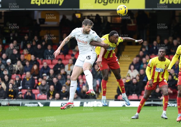 310126 - Watford v Swansea City, EFL Sky Bet Championship - Cameron Burgess of Swansea City and Jeremy Ngakia of Watford compete for the ball
