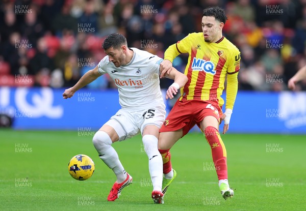 310126 - Watford v Swansea City, EFL Sky Bet Championship - Joel Ward of Swansea City holds off Othmane Maamma of Watford