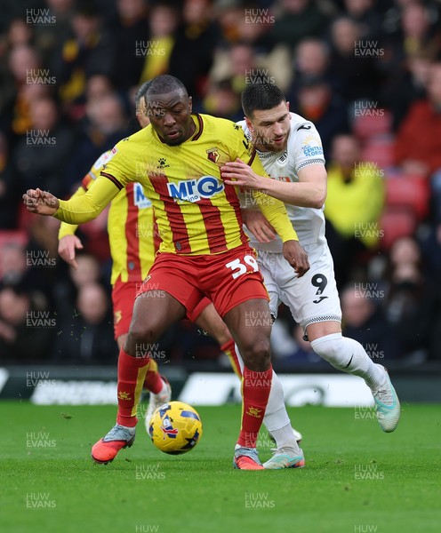 310126 - Watford v Swansea City, EFL Sky Bet Championship - Zan Vipotnik of Swansea City and Edo Kayembe of Watford compete for the ball