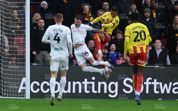 310126 - Watford v Swansea City, EFL Sky Bet Championship - Thomas Ince of Watford looks to head at goal as Josh Tymon of Swansea City challenges