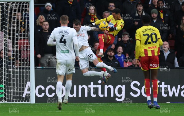 310126 - Watford v Swansea City, EFL Sky Bet Championship - Thomas Ince of Watford looks to head at goal as Josh Tymon of Swansea City challenges