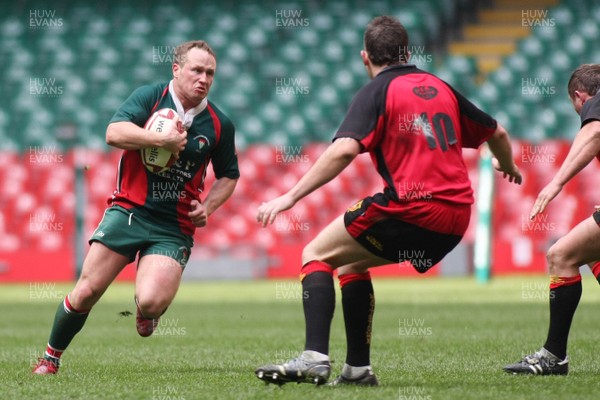 18.04.09 Wattstown RFC. v Camrbrian Welfare RFC.  Worthington Cup Final. Gavin Thomas shows determination as he takes on Nathan Bruford(10) & Chris Evans. 