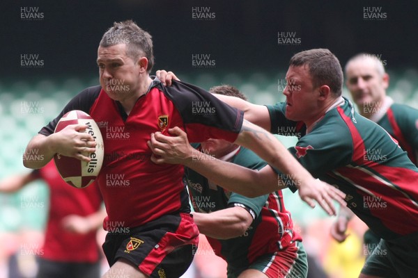 18.04.09 Wattstown RFC. v Camrbrian Welfare RFC.  Worthington Cup Final. Nathan Bruford holds powers through Julian Huntley & Damien Filmer's tackles to score a consolation try. 