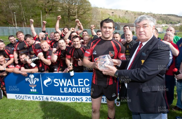 110513 - Wattstown v Pontycymmer, SWALEC League 4 South East - Wattstown RFC captain Nathan Bruford is presented with the SWALEC League 4 South East trophy by WRU board member Humphrey Evans