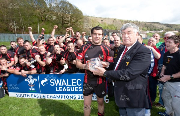 110513 - Wattstown v Pontycymmer, SWALEC League 4 South East - Wattstown RFC captain Nathan Bruford is presented with the SWALEC League 4 South East trophy by WRU board member Humphrey Evans