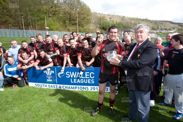 110513 - Wattstown v Pontycymmer, SWALEC League 4 South East - Wattstown RFC captain Nathan Bruford is presented with the SWALEC League 4 South East trophy by WRU board member Humphrey Evans