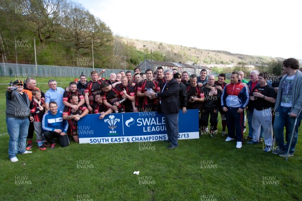 110513 - Wattstown v Pontycymmer, SWALEC League 4 South East - Wattstown RFC captain Nathan Bruford is presented with the SWALEC League 4 South East trophy by WRU board member Humphrey Evans