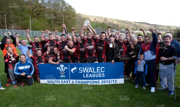 110513 - Wattstown v Pontycymmer, SWALEC League 4 South East - Wattstown RFC captain Nathan Bruford is presented with the SWALEC League 4 South East trophy by WRU board member Humphrey Evans, with coaches Dano Roberts, left, Wayne Davies and Christopher Davies, right