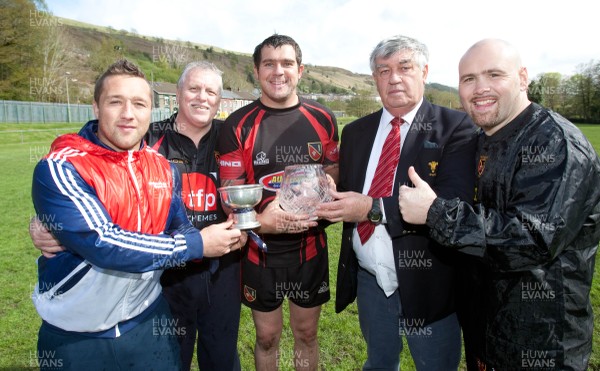 110513 - Wattstown v Pontycymmer, SWALEC League 4 South East - Wattstown RFC captain Nathan Bruford is presented with the SWALEC League 4 South East trophy and the SWALEC Bowl by WRU board member Humphrey Evans, with coaches Dano Roberts, left, Wayne Davies and Christopher Davies, right