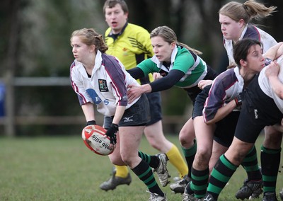 28.03.10 ... Waunarlwydd v Seven Sisters, WRU Women's National Plate Final 2009-10. -  Waunarlwydd's Rachel James is tackled by Layla John  