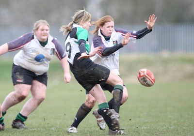 28.03.10 ... Waunarlwydd v Seven Sisters, WRU Women's National Plate Final 2009-10. -  Seven Sisters' Layla John clears 