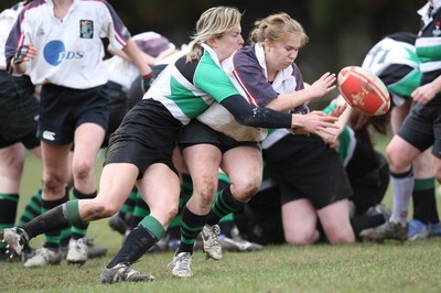 28.03.10 ... Waunarlwydd v Seven Sisters, WRU Women's National Plate Final 2009-10. -  Waunarlwydd Rachel James is tackled by Layla John  