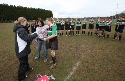 28.03.10 ... Waunarlwydd v Seven Sisters, WRU Women's National Plate Final 2009-10. -  Seven Sisters are presented with gifts by Nicola Smith, WRU Women's Community Rugby Manager  