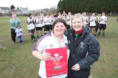 28.03.10 ... Waunarlwydd v Seven Sisters, WRU Women's National Plate Final 2009-10. -  Waunarlwydd's Dee Evans receives a gift from Nicola Smith, WRU Women's Community Rugby Manager to mark her involvement in rugby 