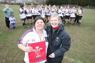 28.03.10 ... Waunarlwydd v Seven Sisters, WRU Women's National Plate Final 2009-10. -  Waunarlwydd's Dee Evans receives a gift from Nicola Smith, WRU Women's Community Rugby Manager to mark her involvement in rugby 