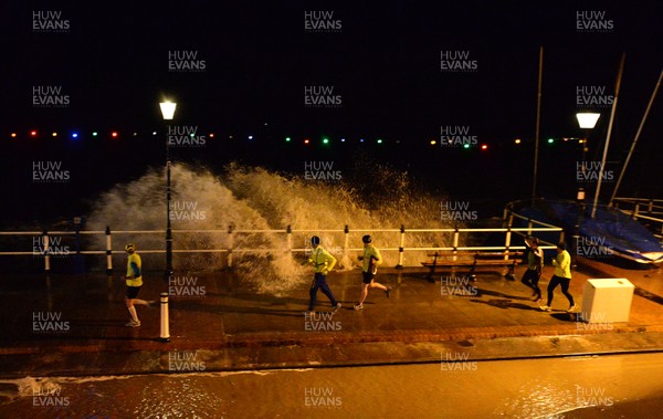 181213 - Weather -Waves crash over the sea front at Penarth, South Wales