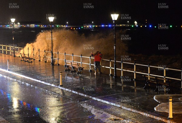 181213 - Weather -Waves crash over the sea front at Penarth, South Wales