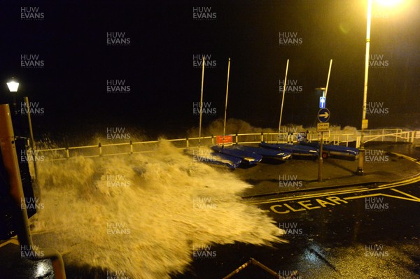 181213 - Weather -Waves crash over the sea front at Penarth, South Wales