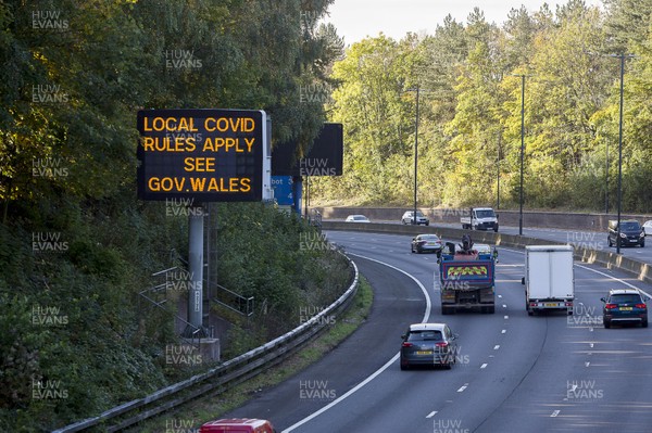 151020 - Picture shows a motorway sign stating that local coronavirus rules apply in Wales on the M4 near Newport Its likely the Welsh Government is to announce a limited circuit-breaker lockdown in the next few days