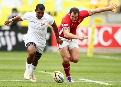 03.02.12 - Hertz Wellington Sevens - Tonga's Vaea Poteki and Wales' Rhys Shellard compete for the ball. 