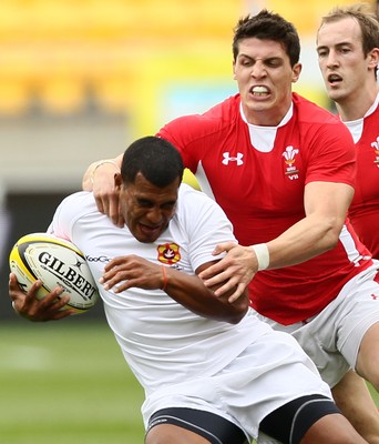 03.02.12 - Hertz Wellington Sevens - Wales' Richard Smith makes a tackle on Tonga's Vaea Poteki. 