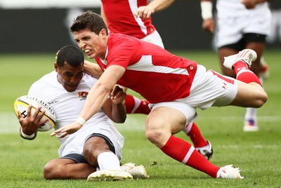 03.02.12 - Hertz Wellington Sevens - Wales' Richard Smith makes a tackle on Tonga's Vaea Poteki. 