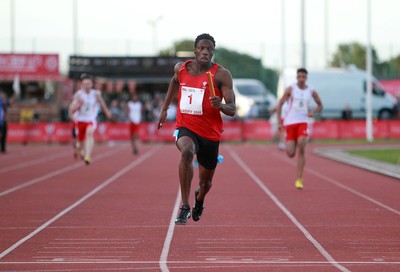 150714 - Welsh Athletics International held at the Cardiff International Sports Stadium - Sam Gordon finishes the last leg to win