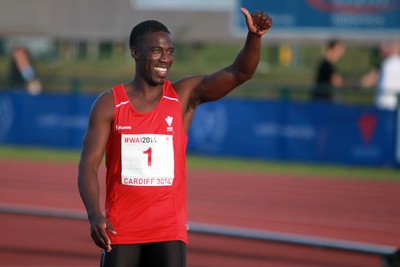 150714 - Welsh Athletics International held at the Cardiff International Sports Stadium - Christian Malcolm thanks the fans after completing his last ever race