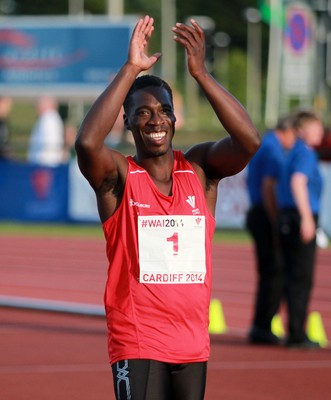 150714 - Welsh Athletics International held at the Cardiff International Sports Stadium - Christian Malcolm thanks the fans after completing his last ever race